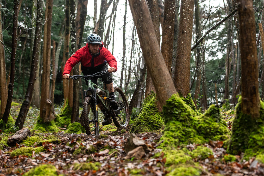 MTB rider in forest after bike component upgrade